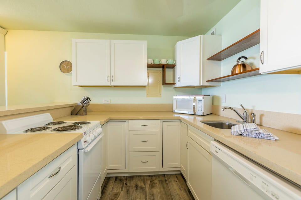 Your kitchen is bright and fully equipped with everything you need to prepare meals at your own pace, from the stove and microwave to plenty of counter and cabinet space for spreading out.