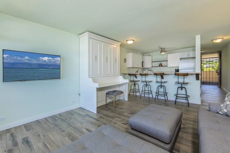 Relax in your open living space where the kitchen breakfast bar invites casual meals and conversation flows easily between rooms.