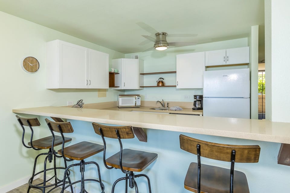 Gather around the spacious breakfast bar in your bright, fully-equipped kitchen. With plenty of counter space and all the appliances you need, you'll feel right at home whipping up meals during your stay.