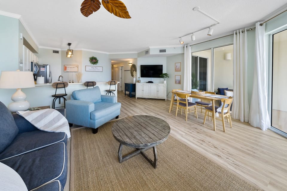large living, dining, and kitchen area for all of your friends and family