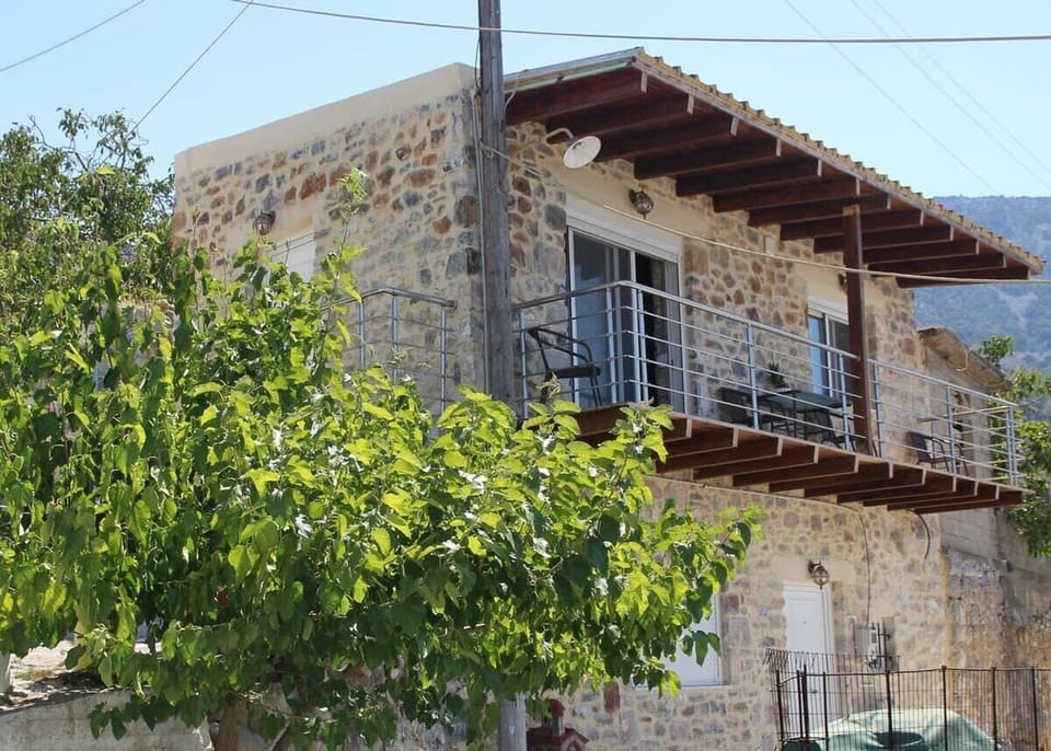 Exterior View of the Stone Property – Traditional stone architecture set in a peaceful environment.