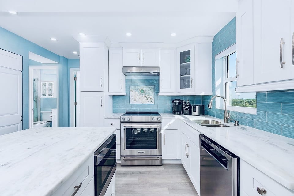 Bright fully stocked kitchen with lots of counter space and pantry.