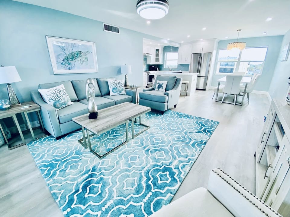 Windows on all sides of this top floor condo provide natural light all day.