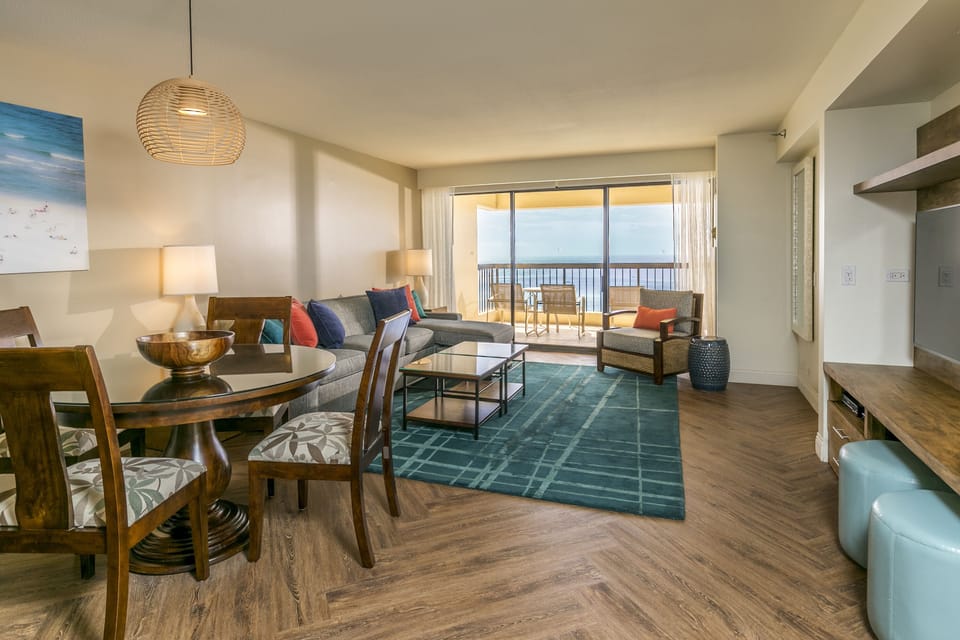 Imagine sipping your morning coffee in this bright, open living space as ocean breezes drift through sliding doors to your private balcony. Tasteful coastal decor and rich wood floors blend comfort with style.