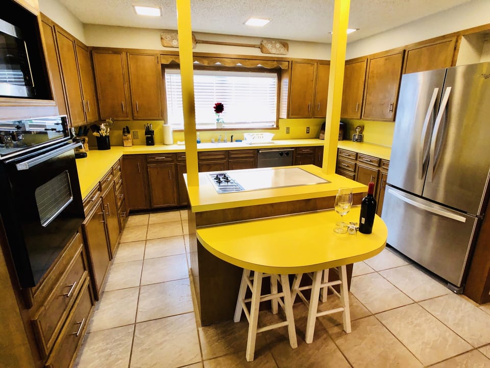 Full kitchen including glassware, seasonings, crock pot, and blender 