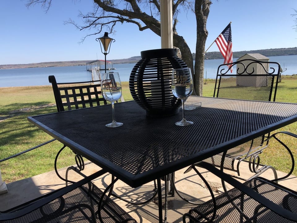 Enjoy a glass of wine on the porch while the kids play in the yard. 