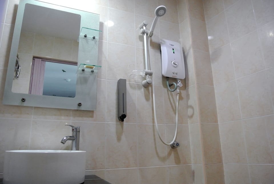 Standard Double Room, 1 Queen Bed | Bathroom | Shower, hair dryer, towels, soap