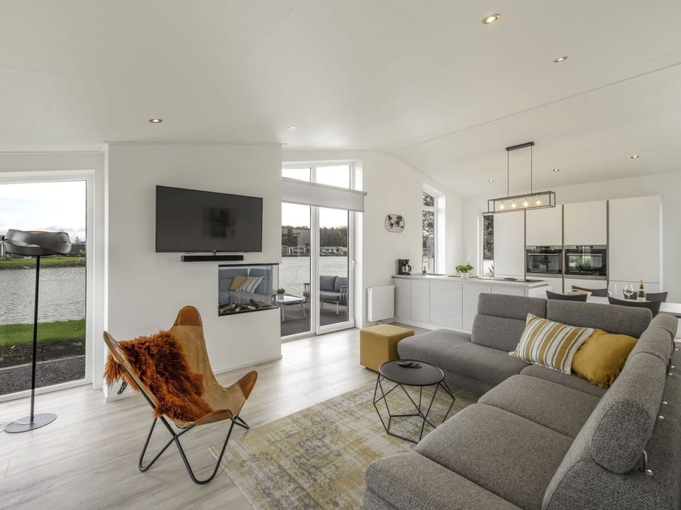 Furniture, Couch, Picture Frame, Living Room, Interior Design, Floor, Flooring, Comfort, Plant