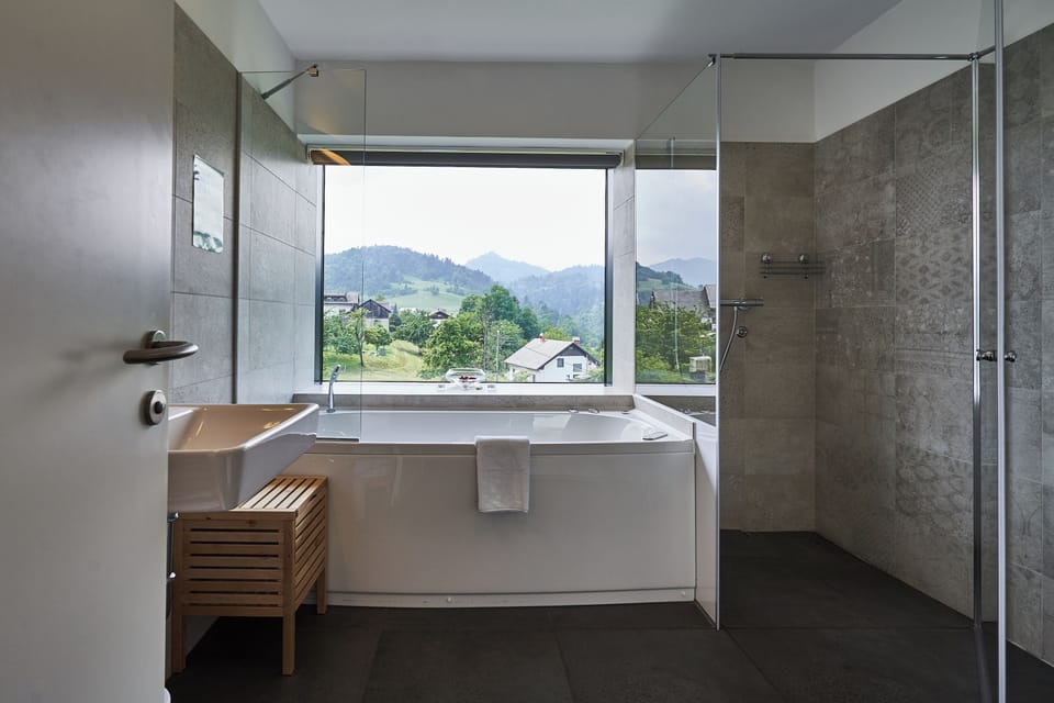 Deluxe Suite, Non Smoking, Hill View | Bathroom | Free toiletries, hair dryer, slippers, towels
