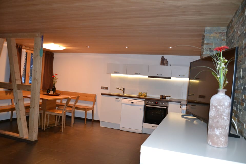 Family Apartment (Ferienwohnung Relax) | Living area | Flat-screen TV, heated floors