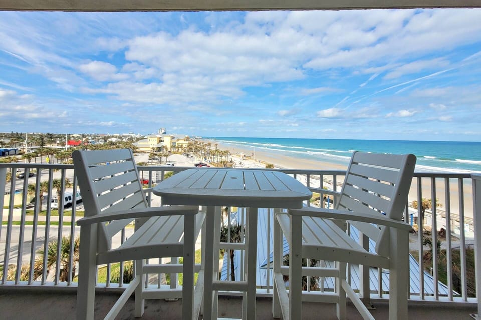 Balcony views of both the ocean and the city with Pollywood high-top table and chairs!