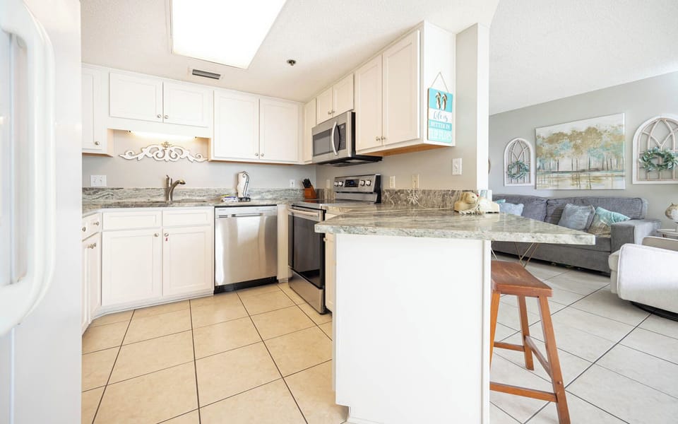 Prepare meals at the spacious kitchen with granite countertops and stainless appliances