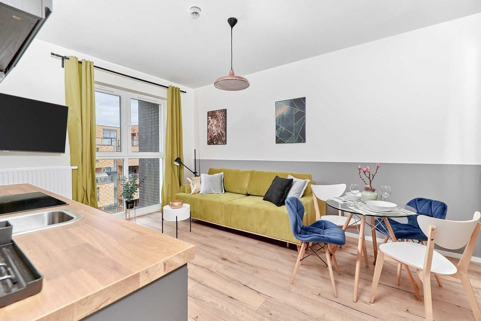 The living room's modern and stylish decor creates a welcoming and atmosphere. 