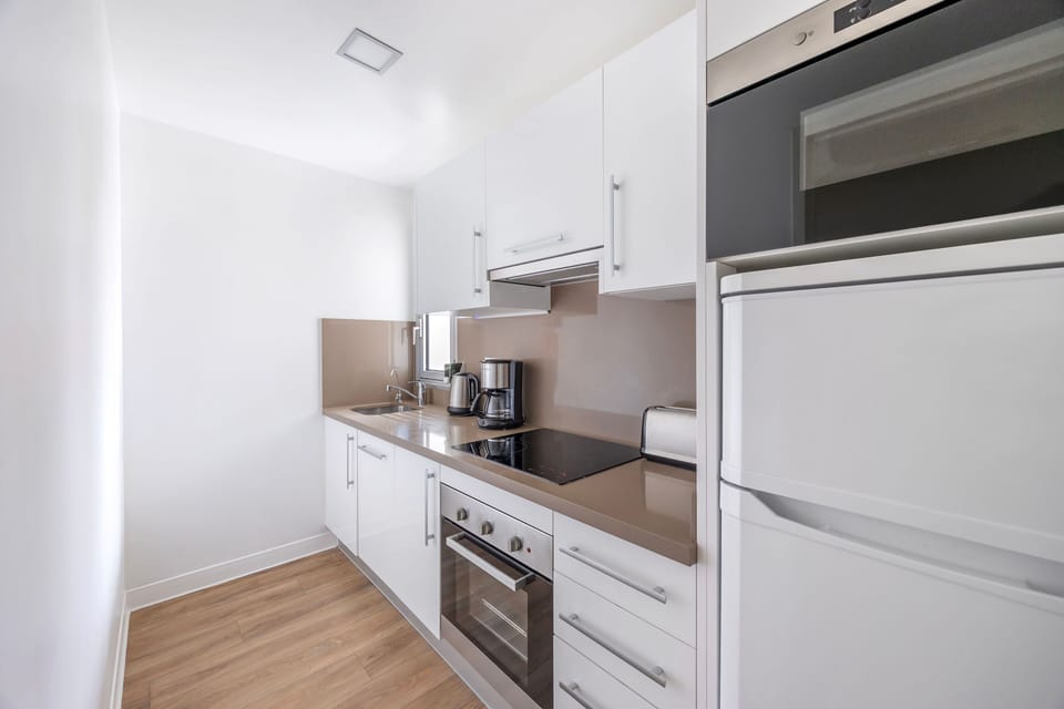 A well equipped kitchen with contemporary appliances makes preparing meals a breeze.