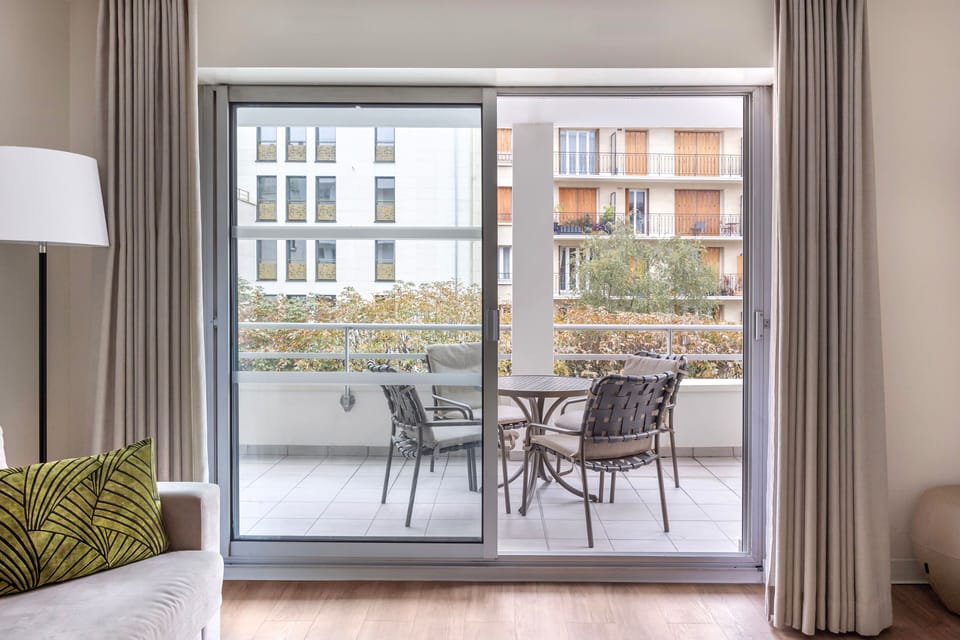 Enjoy fresh air and serene views from your private balcony, complete with outdoor seating for quiet mornings or evenings.