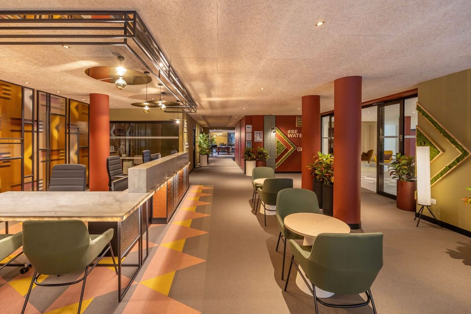 Modern lobby area combining unique artwork and functional seating spaces to create a stylish environment.