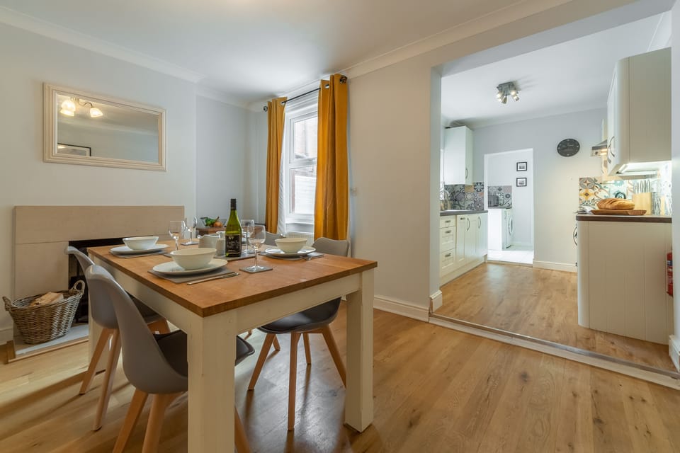 Ground floor: Dining room looking into kitchen
