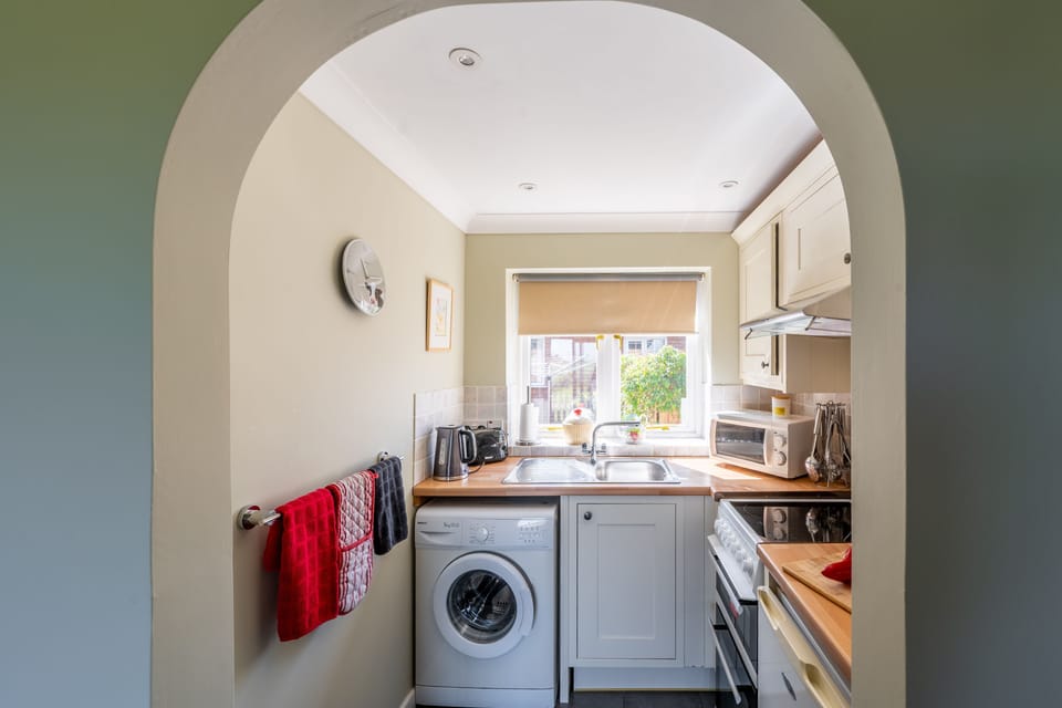 Ground floor: Kitchen through the archway
