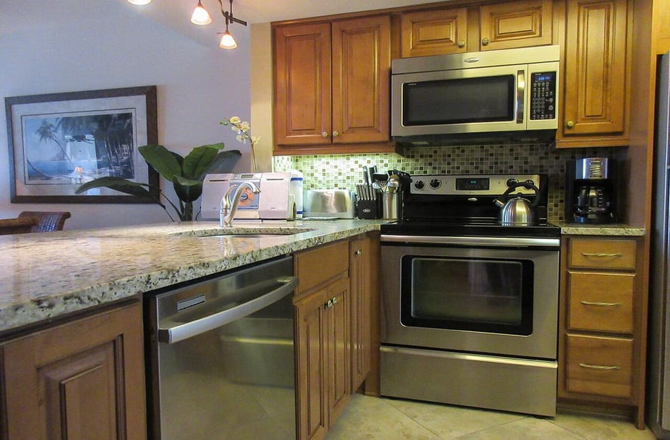 Carlos Pointe 612 Kitchen has new appliances, breakfast bar, granite countertops and in unit washer and dryer