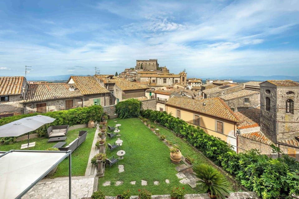 Bask on a rooftop garden terrace with sweeping views of Soriano nel Cimino’s medieval skyline and castle.