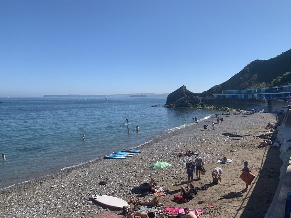 Meadfoot beach with the cafe and paddle boarding hiring facilities
