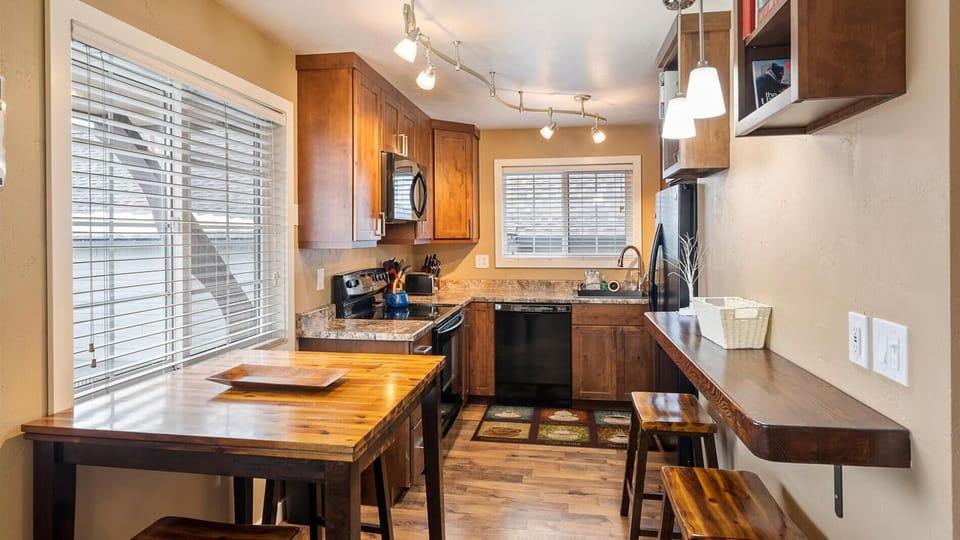 Dining space and fully stocked kitchen with working space for all our work from home travelers.