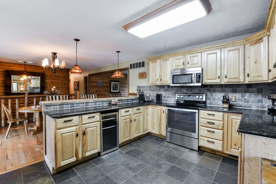 Kitchen with bar and dining table