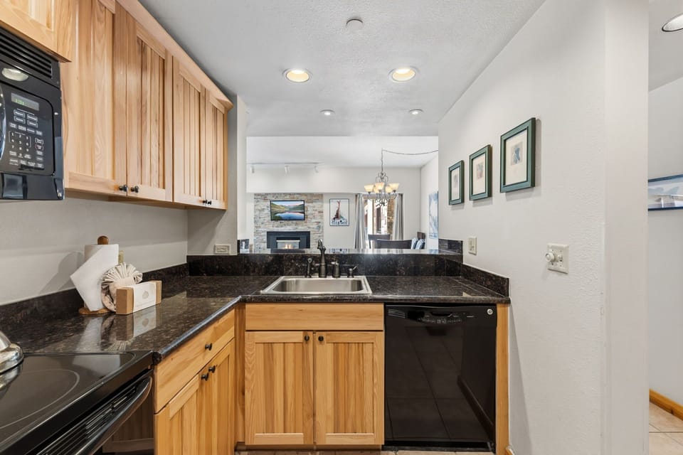 Your well-equipped kitchen awaits with polished countertops and modern appliances, making meal prep easy and enjoyable throughout your stay.