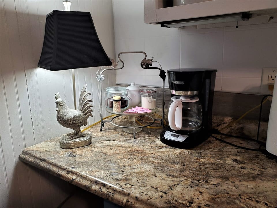 This rooster will not wake you in the morning but the pot of fresh coffee may.  