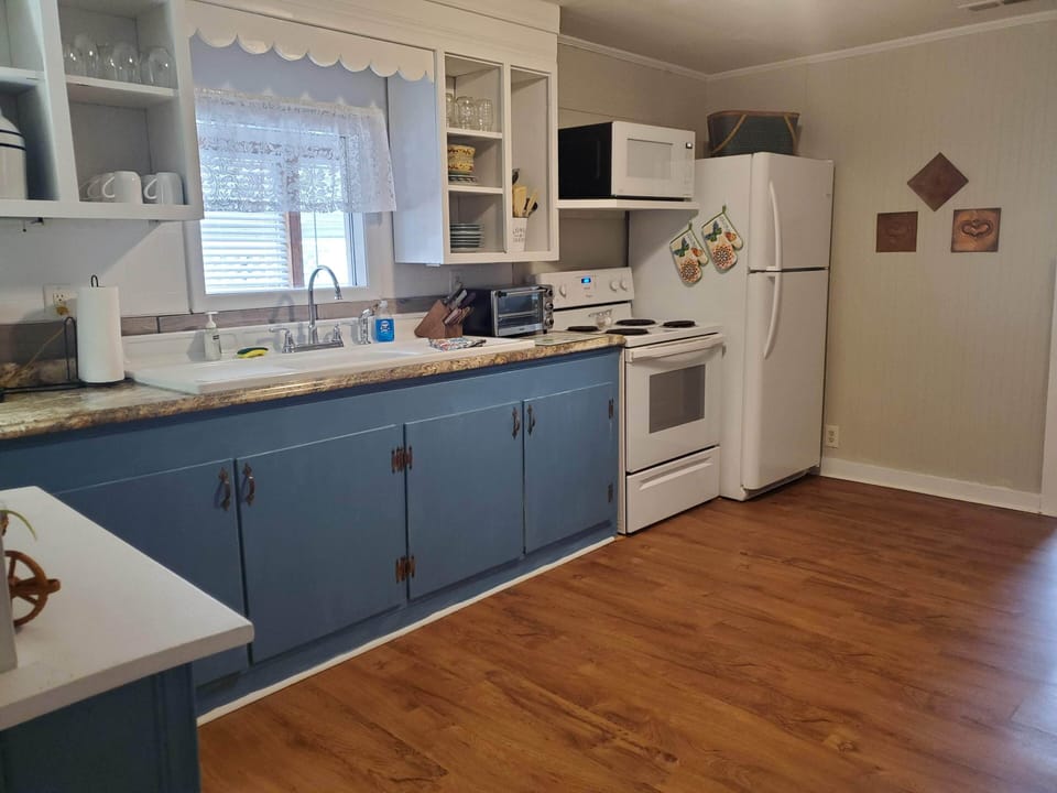 Large full kitchen.   View from living room door.
