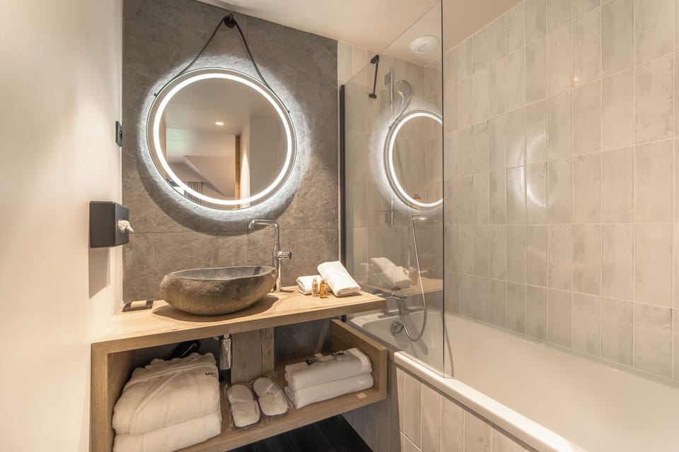 Double room with balcony, village view, double bed or two single beds, shower with disabled access | Bathroom | Eco-friendly toiletries, hair dryer, bathrobes, slippers