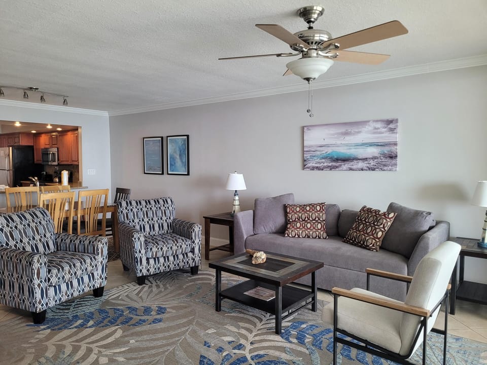 Spacious living room with cozy seating and open dining area