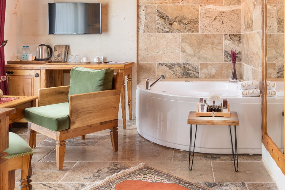 Deluxe Stone Suit | Premium bedding, free minibar, in-room safe, individually decorated