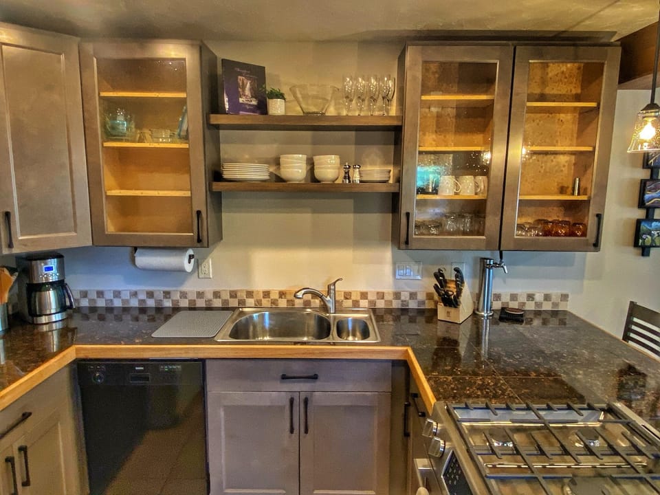 Compact, but complete kitchen. Yes, that is a beer tap to the right of the sink.