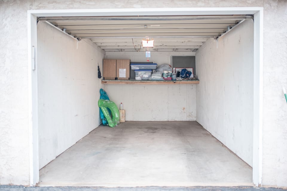 Inside of garage.  A few things inside for your use (pool floaties & umbrella). 