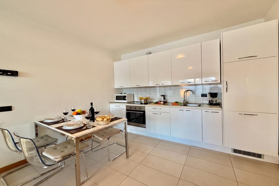 Family Apartment, 2 Bedrooms, Microwave, Mountainside (Residence degli Oleandri 4B) | Private kitchen | Coffee/tea maker, full-size fridge, microwave, oven