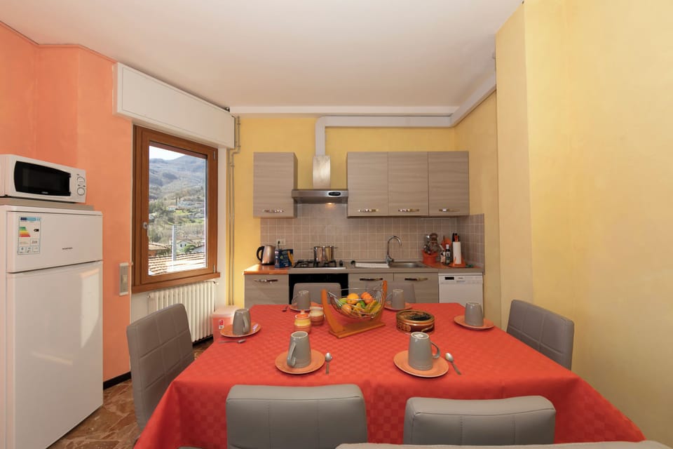 Family Apartment, 2 Bedrooms, Microwave, Mountainside (Il Panorama di Forster) | Private kitchen | Coffee/tea maker, full-size fridge, microwave, oven