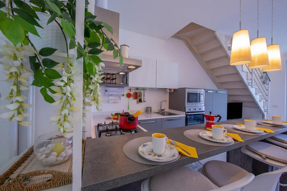 Family Apartment, Multiple Bedrooms, 2 Bathrooms, Mountainside (Como Lake Modern Apartment Ulivi) | Private kitchen | Full-size fridge, microwave, oven, stovetop