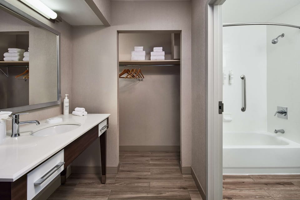 Suite, 1 King Bed, Non Smoking | Bathroom | Combined shower/tub, eco-friendly toiletries, hair dryer, towels