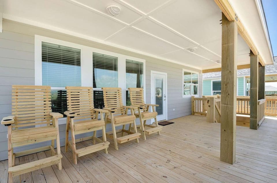 Watch waves and feel the breeze from high deck chairs on porch.