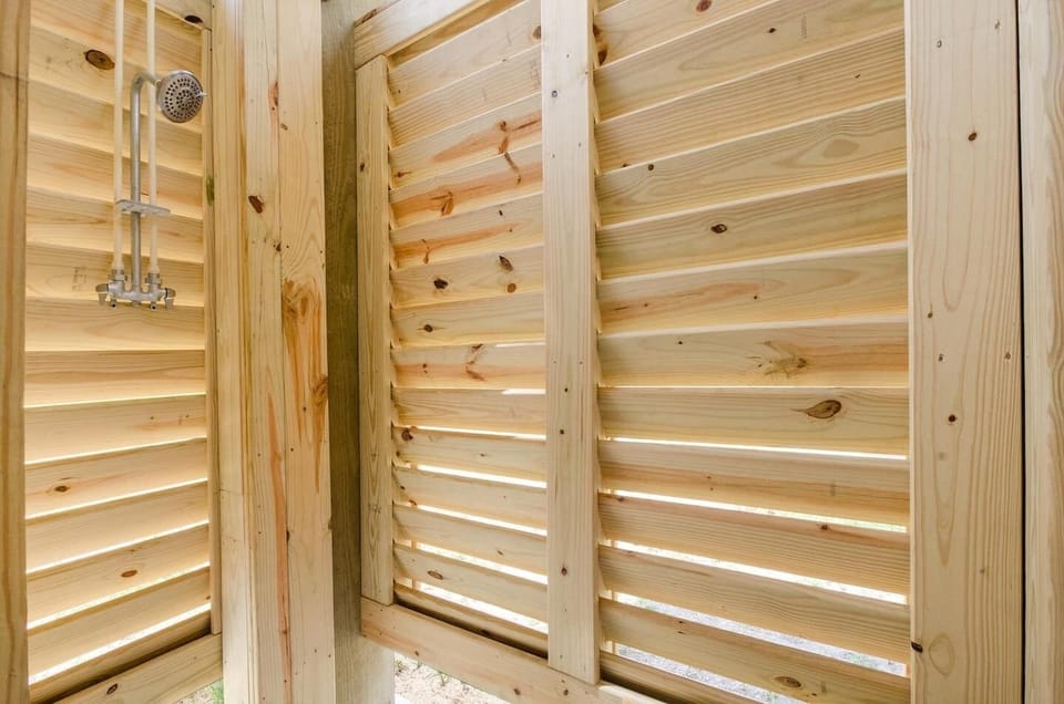 Rinse sand off with hot or cold water in the outdoor beach shower.