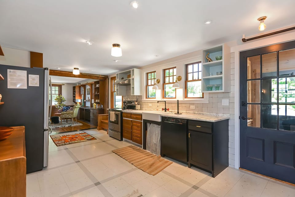 The remodeled kitchen is open to the living room.