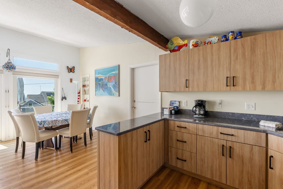 The kitchen is located off the living and dining area.