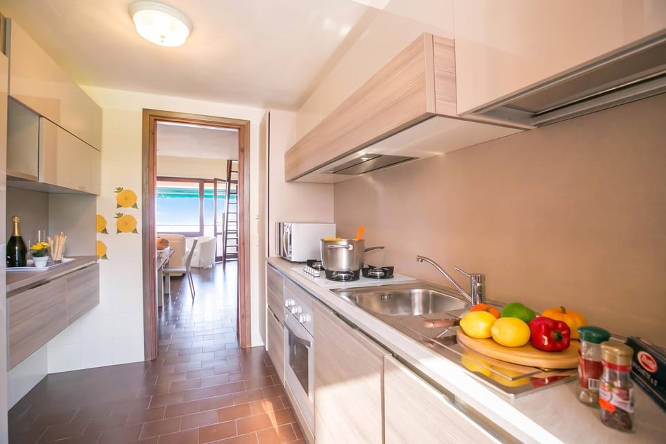Family Apartment, 3 Bedrooms, 2 Bathrooms, Mountainside (Cadenabbia Vista Lago) | Private kitchen | Full-size fridge, microwave, oven, stovetop