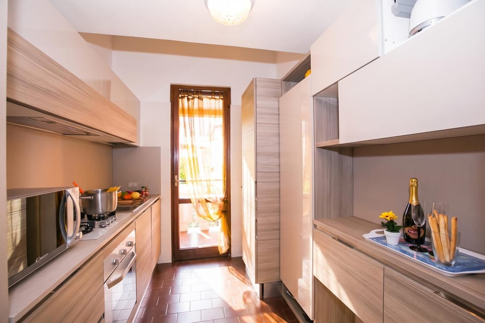 Family Apartment, 3 Bedrooms, 2 Bathrooms, Mountainside (Cadenabbia Vista Lago) | Private kitchen | Full-size fridge, microwave, oven, stovetop