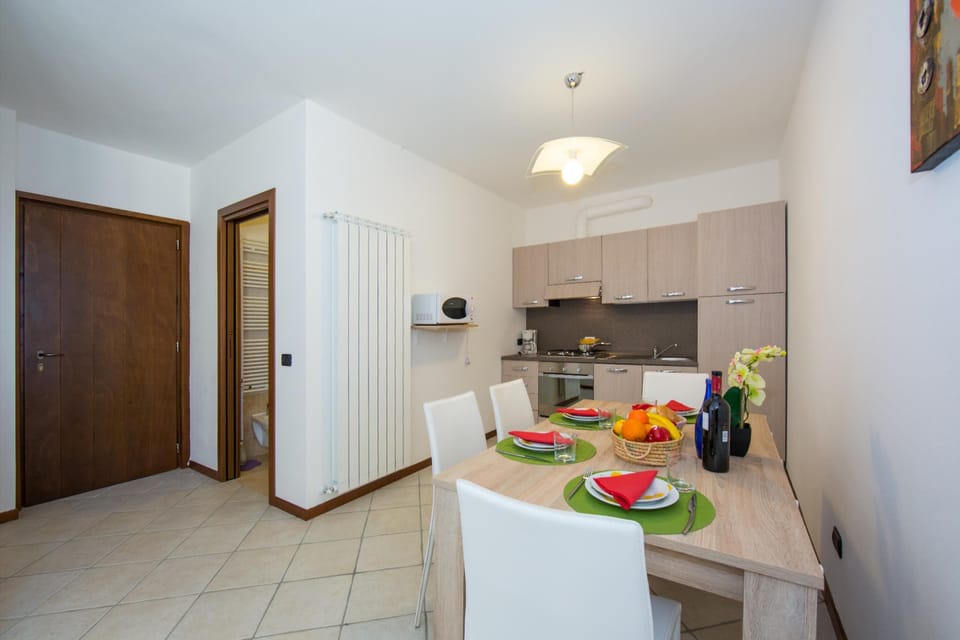 Family Apartment, Multiple Bedrooms, 2 Bathrooms, Mountainside (Borgo La Sorgente - Erica) | Private kitchen | Microwave, oven, stovetop, dishwasher