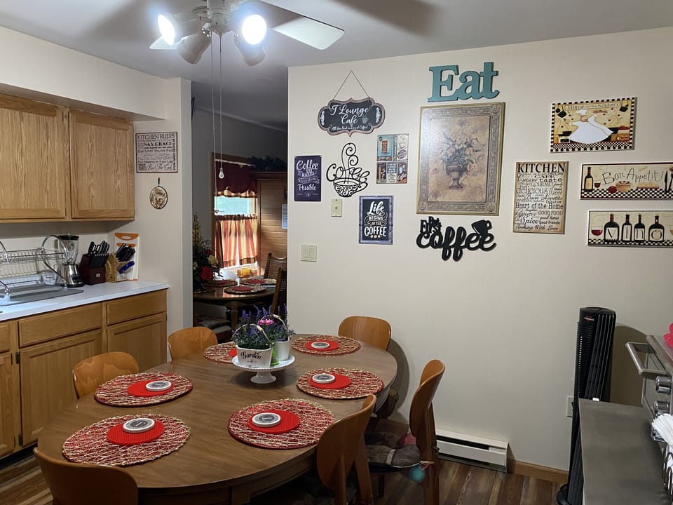 Kitchen: Dining table & chairs, floor fan, blender, knives set, cutting boards 