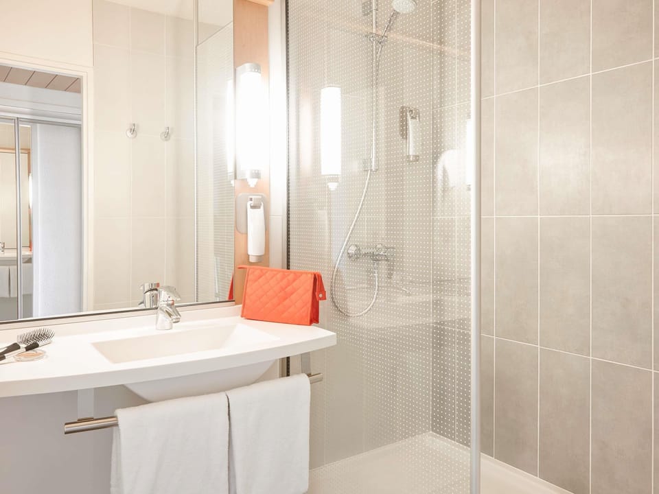 Shower, eco-friendly toiletries, hair dryer, towels