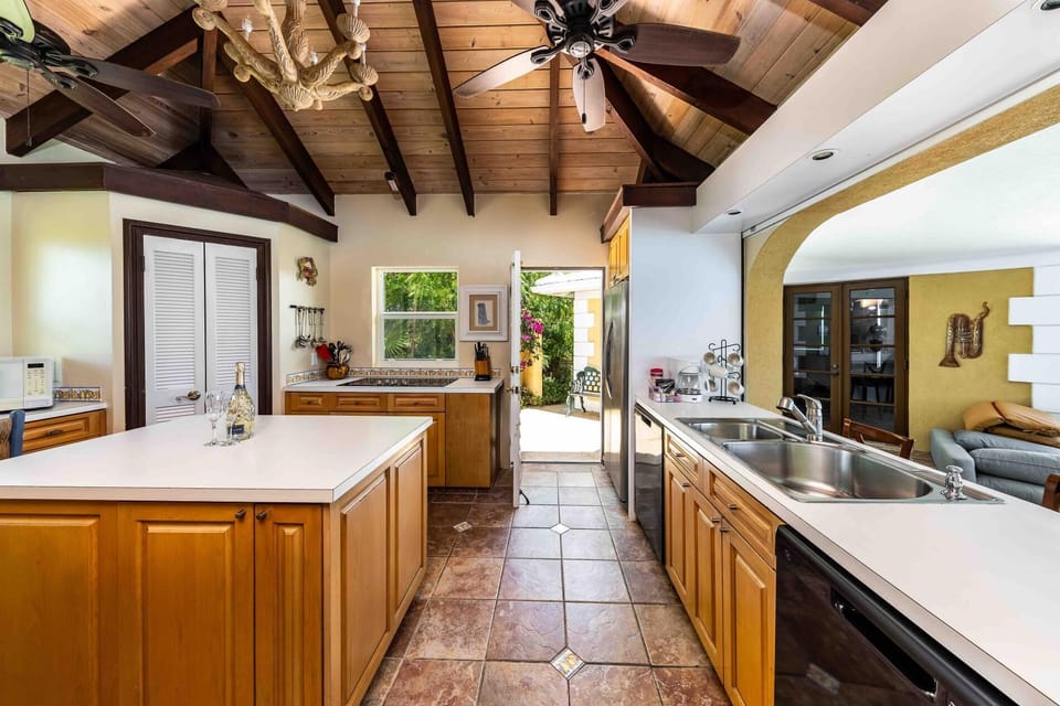 The kitchen at South Seas features a large island and outdoor bbq patio.