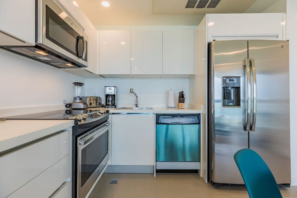 Your sleek, fully-equipped kitchen makes it easy to whip up anything from morning coffee to gourmet meals, with modern stainless steel appliances and all the prep space you need.